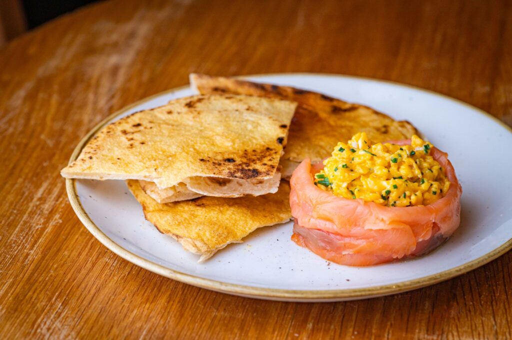 Smoked salmon and scrambled eggs with toasted flatbread at The Granary